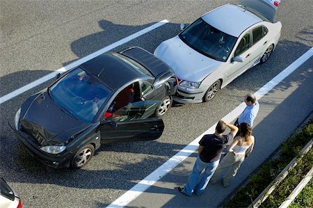 Three people stand by the roadside, discussing what has happened after a small shunt on the freeway (motorway, autoroute, autobahn). Stock Photo - Budget Royalty-Free & Subscription, Code: 400-04975375