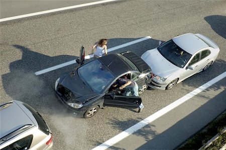 fender - A small shunt on the freeway (motorway, autoroute, autobahn) a few seconds after it happened. Steam can be seen coming from under the bonnet of the black car. Motion blur on the passenger fleeing in panic. Stock Photo - Budget Royalty-Free & Subscription, Code: 400-04975373