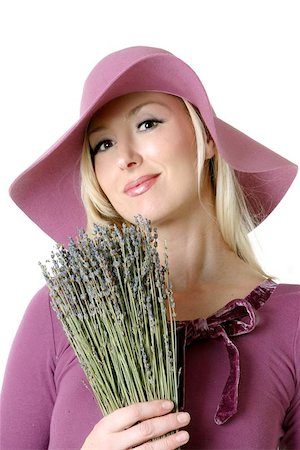 simsearch:400-05131187,k - Woman with a bunch of dried lavender.  Originally found in the Mediterranean countries, the  herb lavender, has long been used for it?s perfume and medicinal qualities. The ancient Romans used it for healing and antiseptic qualities.  The name itself comes from the Latin "lavare" to wash. Stock Photo - Budget Royalty-Free & Subscription, Code: 400-04977352