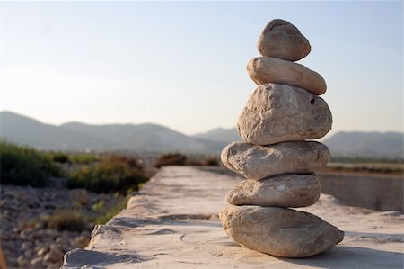 Pile of pebbles in soft evening light Foto de stock - Royalty-Free Super Valor e Assinatura, Número: 400-04977658