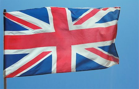 simsearch:400-06326700,k - British Flag blowing in full flight with bright blue sky in background Foto de stock - Super Valor sin royalties y Suscripción, Código: 400-04978136