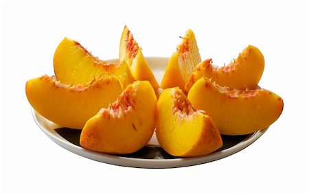 peach slice - sliced peach on the plate Stock Photo - Budget Royalty-Free & Subscription, Code: 400-04978297