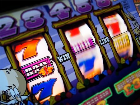 slot machine wheels spinning, reels brightly lit, differential focus Stock Photo - Budget Royalty-Free & Subscription, Code: 400-04978370