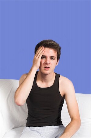 simsearch:400-04978521,k - man with headache over blue background Stock Photo - Budget Royalty-Free & Subscription, Code: 400-04978523