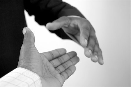 simsearch:400-03956950,k - This is an image of a two hands about to perform a handshake. Foto de stock - Royalty-Free Super Valor e Assinatura, Número: 400-04978645