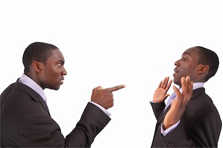 This is an image of business man arguing against himself. This represents "Self blame", "Accusation", "Fault" etc.. Fotografie stock - Microstock e Abbonamento, Codice: 400-04978798