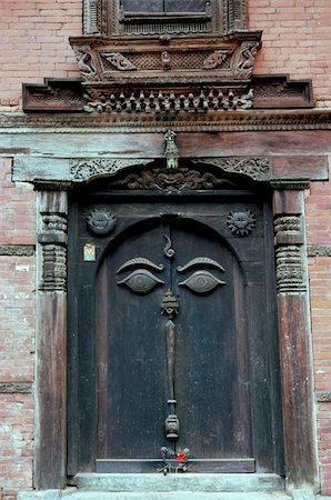 wooden door in Bhaktapur, Nepal with eye of Buddha symbol-- from Durbar Square area Stock Photo - Budget Royalty-Free & Subscription, Code: 400-04978960