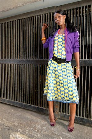 This is an image of a female model striking a pose in an urban environment. Photographie de stock - Aubaine LD & Abonnement, Code: 400-04979078