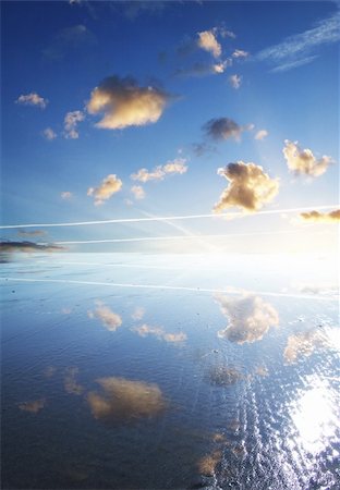 simsearch:400-05172889,k - A open blue sky reflected on a water covered beach. Photographie de stock - Aubaine LD & Abonnement, Code: 400-04979125