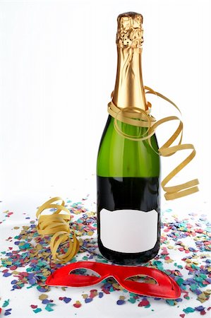 simsearch:400-05082002,k - Champagne bottle with red mask, ribbons and confetti. Blank label for add text Photographie de stock - Aubaine LD & Abonnement, Code: 400-04979595