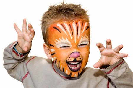 Kid with tiger painted face. On white background. Photographie de stock - Aubaine LD & Abonnement, Code: 400-04979631