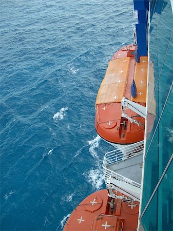orange covered lifeboats, shipside above the caribbean Stock Photo - Budget Royalty-Free & Subscription, Code: 400-04979694
