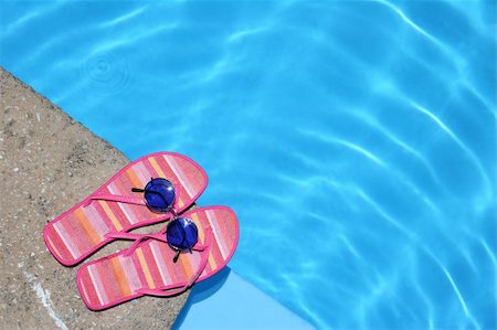 pink flip flops beach - Pink flip-flops and sunglasses by blue pool Stock Photo - Budget Royalty-Free & Subscription, Code: 400-04979850