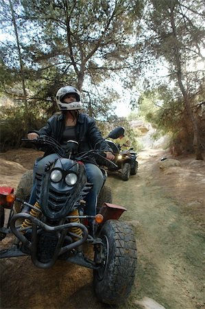 quad biking - A shot of two quad bikers from the front going along a woodland trail. Stock Photo - Budget Royalty-Free & Subscription, Code: 400-04979860