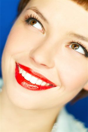 simsearch:400-03954263,k - Portrait of beautiful young smiling woman with red lipstick Photographie de stock - Aubaine LD & Abonnement, Code: 400-04970068
