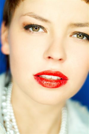 simsearch:400-03954263,k - Portrait of beautiful young smiling woman with red lipstick Photographie de stock - Aubaine LD & Abonnement, Code: 400-04970060
