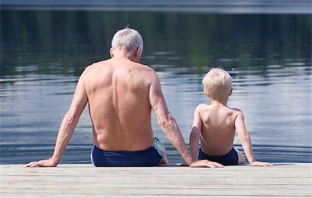 swimming grandparent - Grandfather and Grandson sitting on a footbridge Stock Photo - Budget Royalty-Free & Subscription, Code: 400-04970310