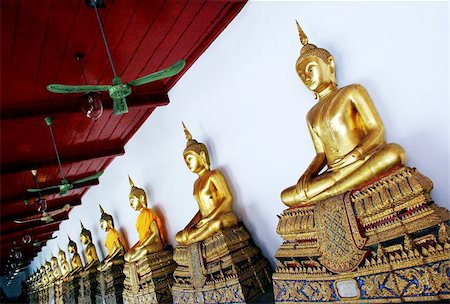 simsearch:400-05010927,k - Gold Buddha statues at the Thawon Wathru building (formerly the Hor Phra Samut Vajiravudh library) in Bangkok, Thailand Foto de stock - Royalty-Free Super Valor e Assinatura, Número: 400-04970859