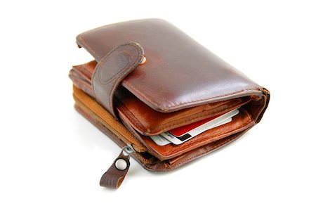 Old leather wallet full of credit cards on white background Stock Photo - Budget Royalty-Free & Subscription, Code: 400-04970851