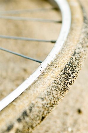 rim sand - Bicycle tire laden with sand grains Stock Photo - Budget Royalty-Free & Subscription, Code: 400-04970954