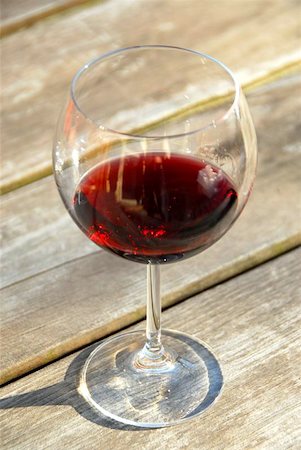 Glass of red wine on old rustic table Stock Photo - Budget Royalty-Free & Subscription, Code: 400-04972070