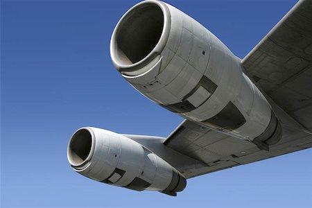 plane flying large sky blue wing - A section of a jumbo jet, viewed from below. Stock Photo - Budget Royalty-Free & Subscription, Code: 400-04972630