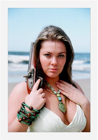 photo of a woman holding a pistol Stock Photo - Budget Royalty-Free & Subscription, Code: 400-04972832