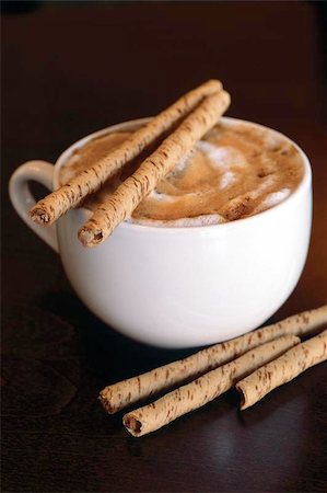 simsearch:400-04518865,k - Hot cappucino with chocolate sticks on a dark wood table. Stock Photo - Budget Royalty-Free & Subscription, Code: 400-04973123