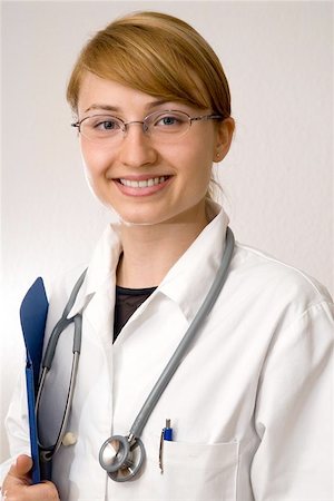 young pretty doctor with stethoscope Fotografie stock - Microstock e Abbonamento, Codice: 400-04973331