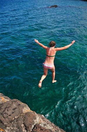 Kid Diving Off Black Rock Presque Isle Park Marquette Michigan Stock Photo - Budget Royalty-Free & Subscription, Code: 400-04984051