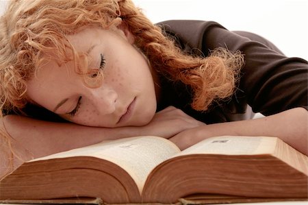 simsearch:400-03923096,k - curly redhead sleeping on book Stock Photo - Budget Royalty-Free & Subscription, Code: 400-04984091