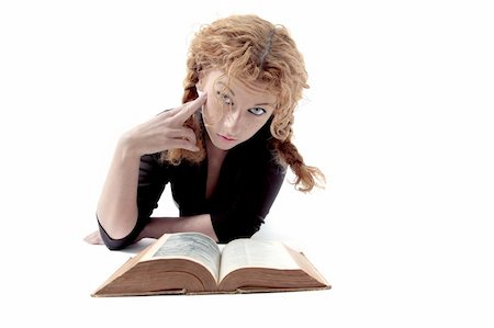 simsearch:400-03923096,k - Confused redhaired girl looking up from book Stock Photo - Budget Royalty-Free & Subscription, Code: 400-04984104