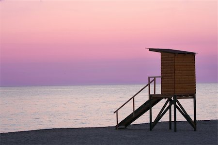 empty beach sunrise - details of life guard tower and ocean Stock Photo - Budget Royalty-Free & Subscription, Code: 400-04984188