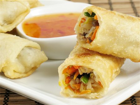 Delicious egg rolls filled with chicken, napa cabbage, carrots, mung bean sprouts, wood ear fungus, and green onions. Served with a sweet chili sauce. Stock Photo - Budget Royalty-Free & Subscription, Code: 400-04984531