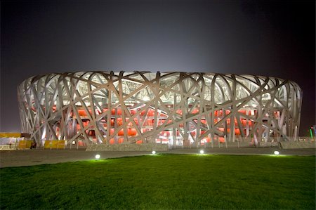 Beijingl Olympic Stadium also known as the "Bird's Nest" for its architecture. The stadium will host the main track and field competitions for the 2008 Summer Olympics, as well as the opening and closing ceremonies. Architects: Herzog & de Meuron. Fotografie stock - Microstock e Abbonamento, Codice: 400-04984624