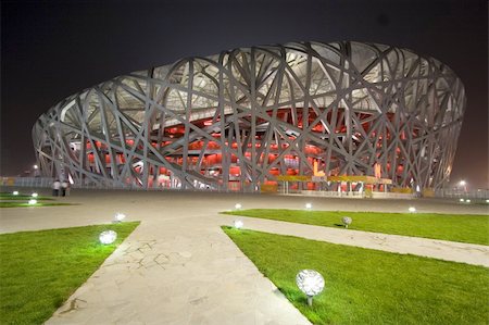 Beijing National Olympic Stadium also known as the "Bird's Nest" for its architecture. The stadium will host the main track and field competitions for the 2008 Summer Olympics, as well as the opening and closing ceremonies. Architects: Herzog & de Meuron. Fotografie stock - Microstock e Abbonamento, Codice: 400-04984631