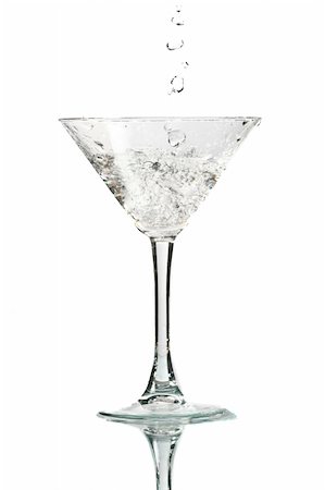 spilled alcoholic drink on bar - coctail splash on white background close up Stock Photo - Budget Royalty-Free & Subscription, Code: 400-04985320