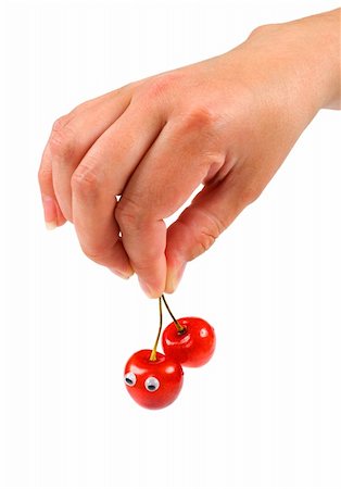 simsearch:400-05196174,k - Female hand holding two sweet cherry with eyes Photographie de stock - Aubaine LD & Abonnement, Code: 400-04985365