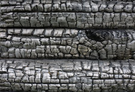 fuliggine - Black surface of the charred cracked wood Fotografie stock - Microstock e Abbonamento, Codice: 400-04985363