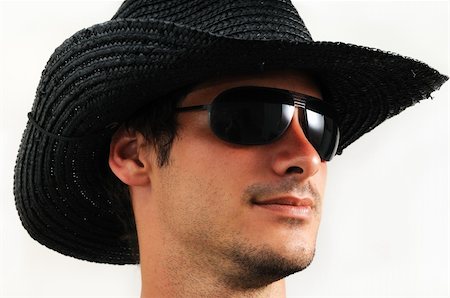 fashions cowboys for male - Portrait of young fashionable man wearing sunglasses - isolated Stock Photo - Budget Royalty-Free & Subscription, Code: 400-04985678