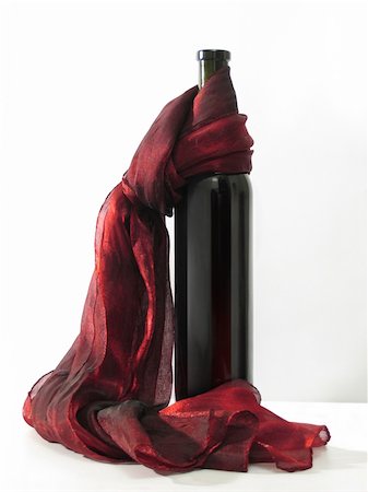 Wine bottle and  red scarf on a white background Stock Photo - Budget Royalty-Free & Subscription, Code: 400-04986583