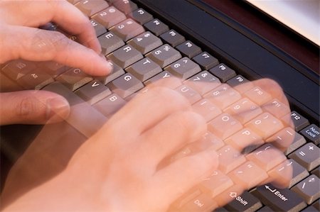 Person typing quickly on the keyboard of a computer with motion blur Stock Photo - Budget Royalty-Free & Subscription, Code: 400-04986695