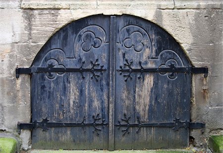 Ancient dark blue church gate, are locked from within. Stock Photo - Budget Royalty-Free & Subscription, Code: 400-04987065