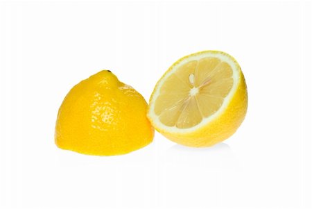simsearch:400-08814206,k - Two lemon halves isolated on the white background Photographie de stock - Aubaine LD & Abonnement, Code: 400-04987176