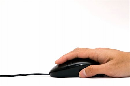 rosliothman (artist) - A hand holding a black optical computer mouse on a white background - isolated Foto de stock - Super Valor sin royalties y Suscripción, Código: 400-04987800