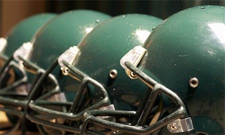 a macro of few football helmet on bench Stock Photo - Budget Royalty-Free & Subscription, Code: 400-04988281