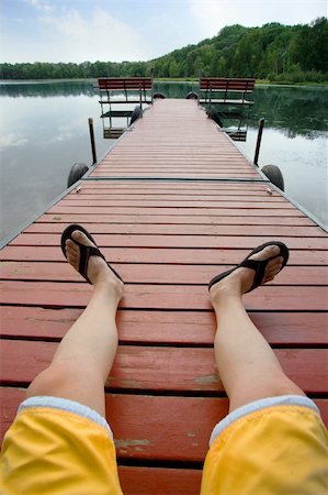 dock on a lake summer feet - Man relaxing on a dock by small lake Stock Photo - Budget Royalty-Free & Subscription, Code: 400-04988988