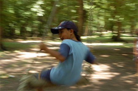 simsearch:400-06737087,k - Child on the forest swing Fotografie stock - Microstock e Abbonamento, Codice: 400-04989664