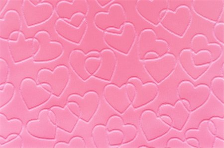 Pastel pink linked hearts embossed on paper. Stock Photo - Budget Royalty-Free & Subscription, Code: 400-04980848