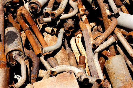 scrap yard pile of cars - old rusting exhaust systems piled up in a scrap yard Stock Photo - Budget Royalty-Free & Subscription, Code: 400-04981420